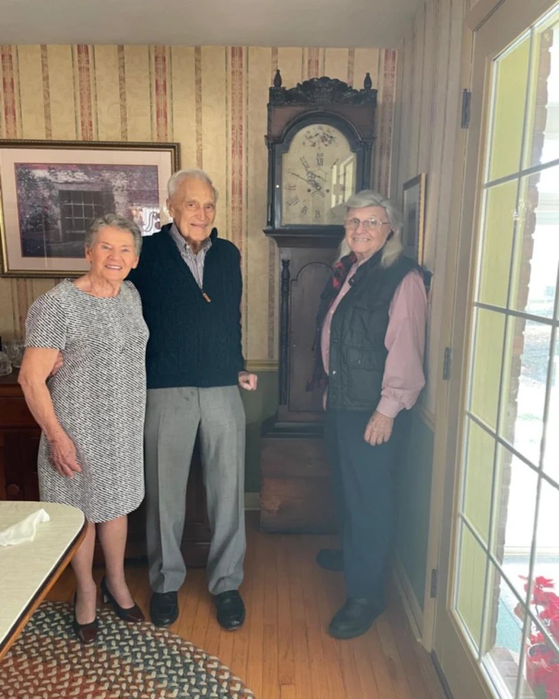 Restored antique grandfather clock in a customer's home