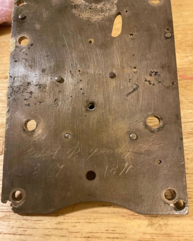 Hand-engraved antique clock movement back plate