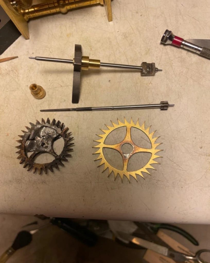Hand-fabricated clock escape wheel and gear close-up